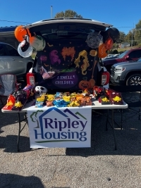 Trunk or Treat table and vehicle with treats.